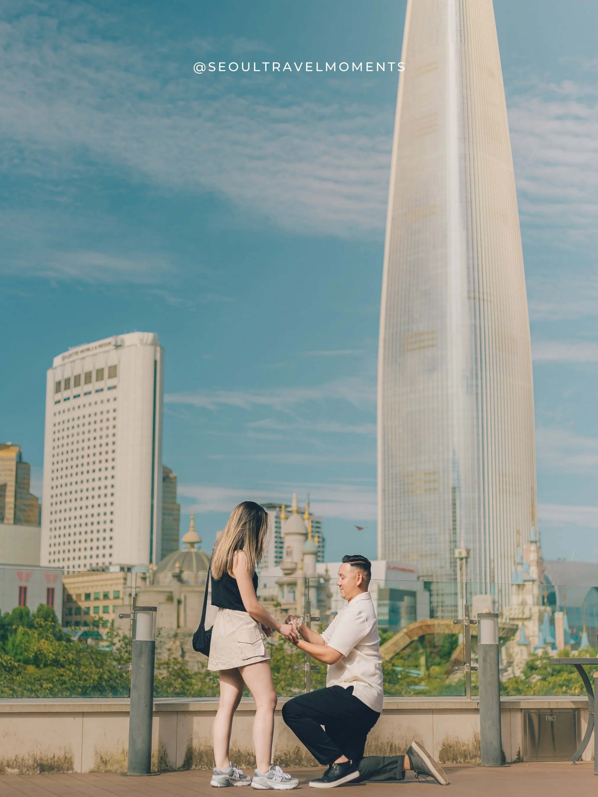 Romantic engagement photoshoot at Yeouido Park in Seoul, capturing a couple during a quiet proposal moment by the riverside.