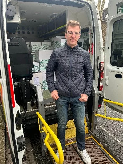 In front of an ambulance loaded with 100 boxes of disposables donated by the Intersurgical company. (Copy)