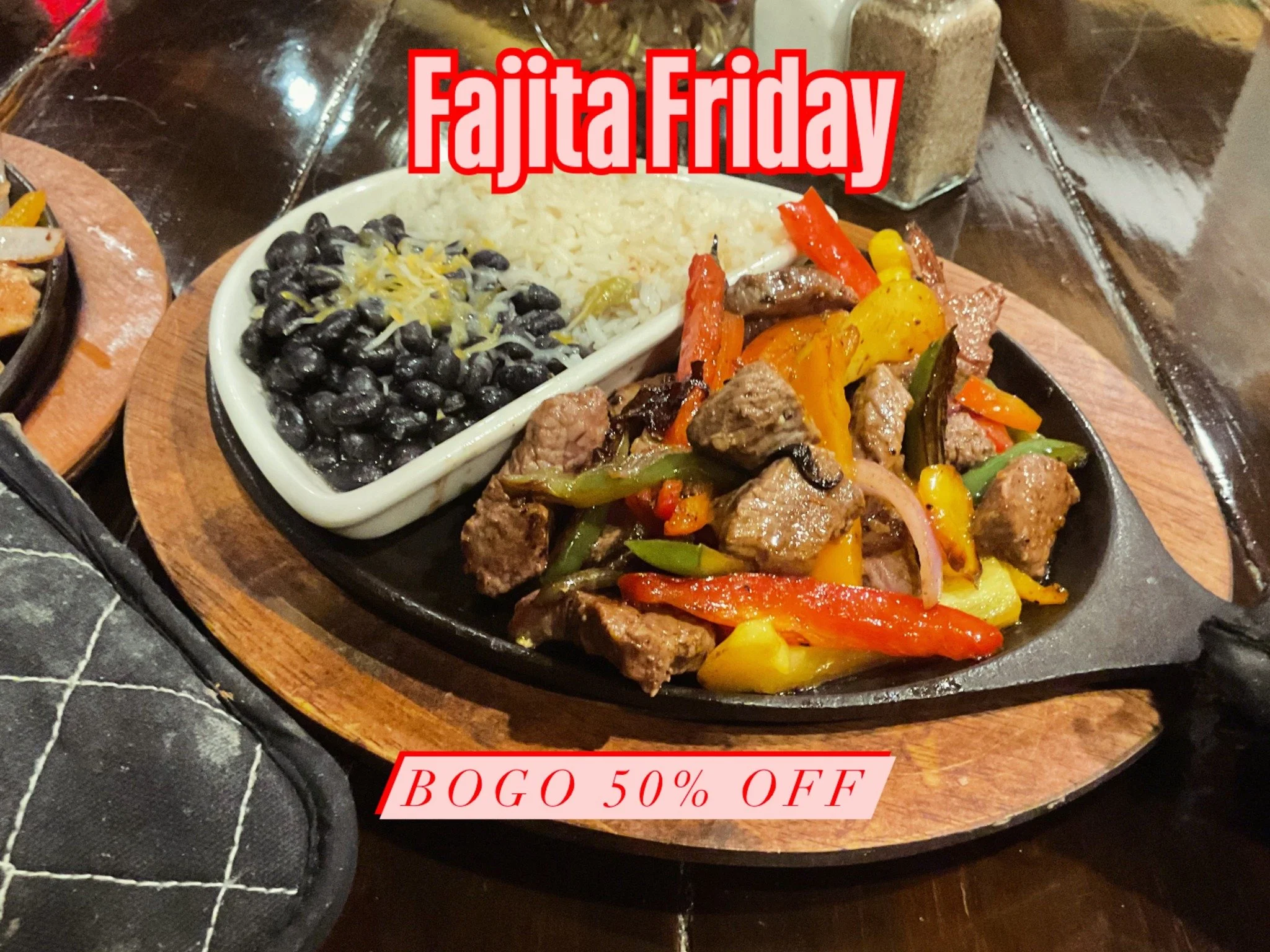 Fajita Friday promotional image featuring a sizzling steak fajita with colorful peppers and onions, black beans topped with shredded cheese, white rice, and a salt shaker, with a banner offering 50% off BOGO deal.