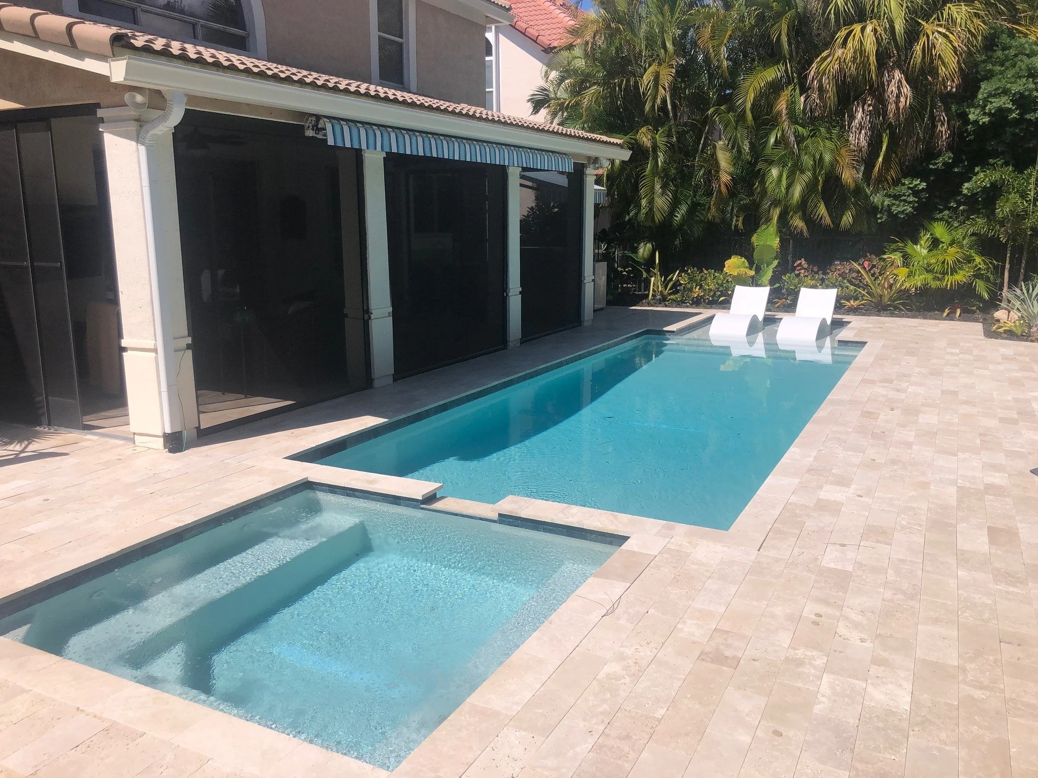 Lap pool with flush spa and stone paver deck.jpg