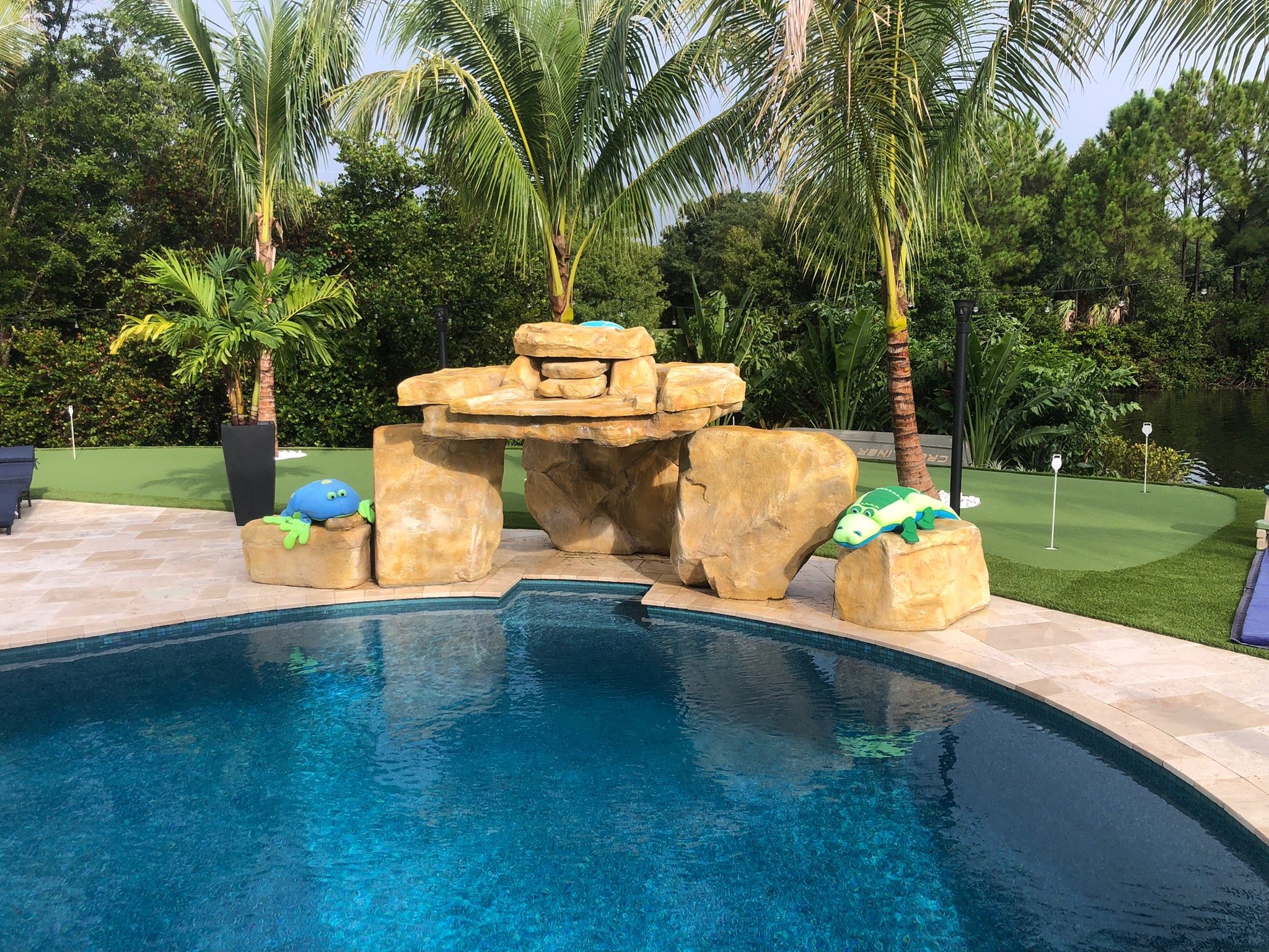Rock waterfall on freeform pool.jpg