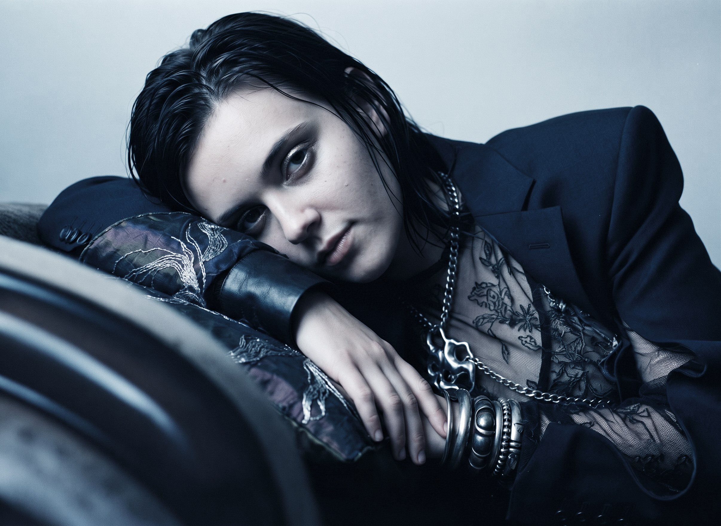 Elegance slips out of line. A flower becomes a mask; velvet, a stage; a tailored jacket, a quiet act of defiance.