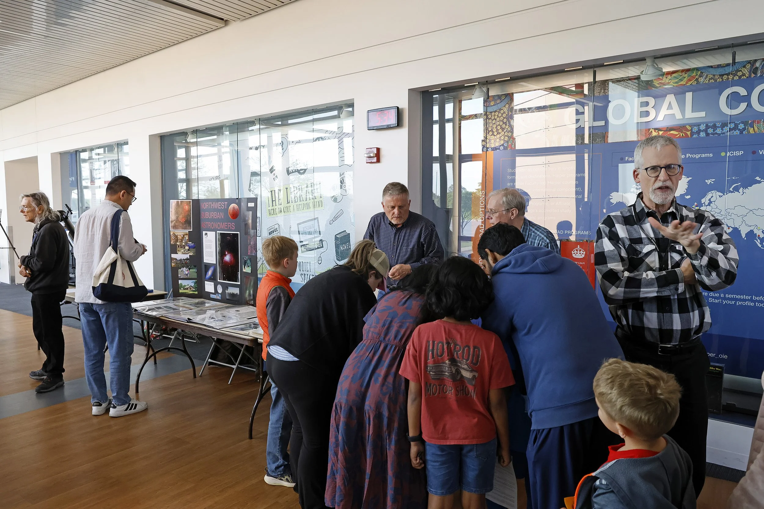 John McBride, Mike McClaughry, and Tim Klepaczyk greet visitors.jpg