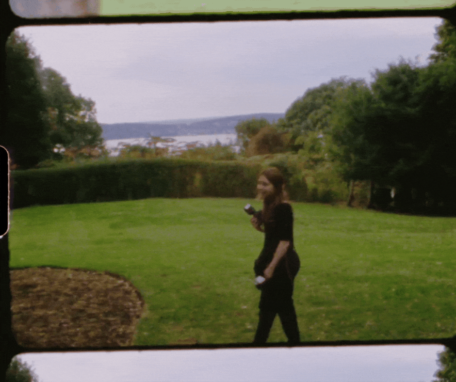 Charlie smiling and walking towards camera with border