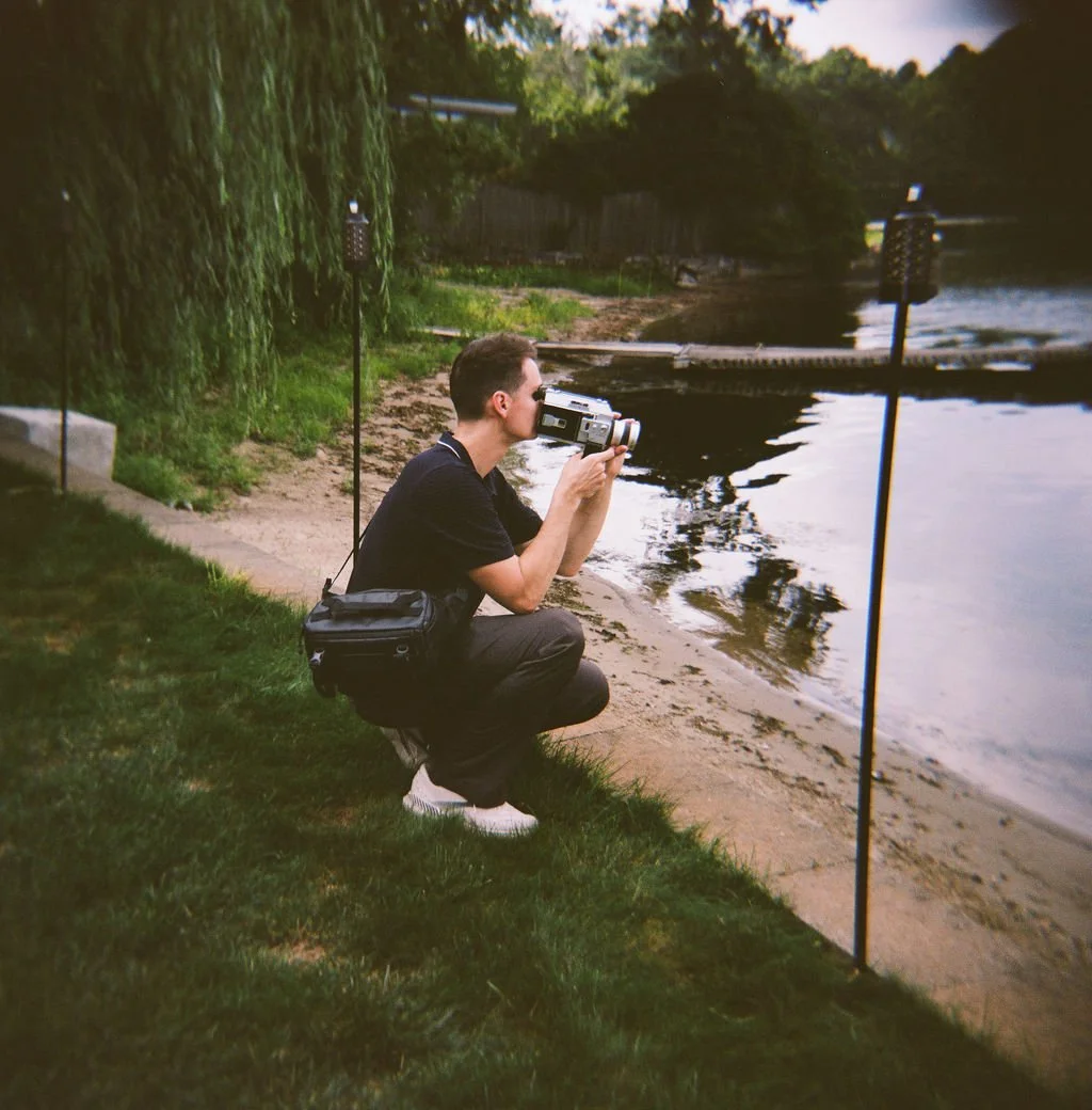 Nate taking a Super 8 film clip with border