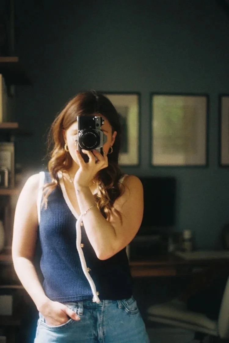 photographer taking photo in mirror with border