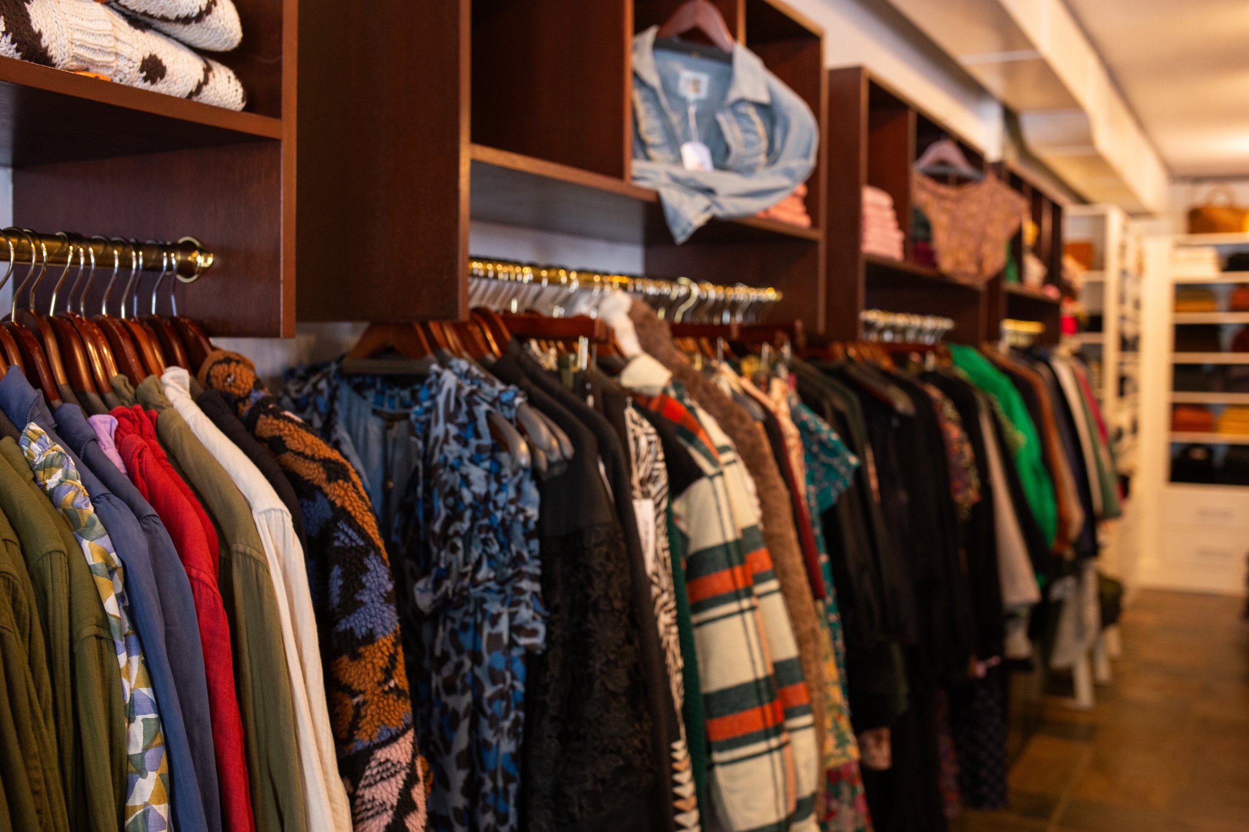 Inside Capucine's retail store showcasing various styles of clothing