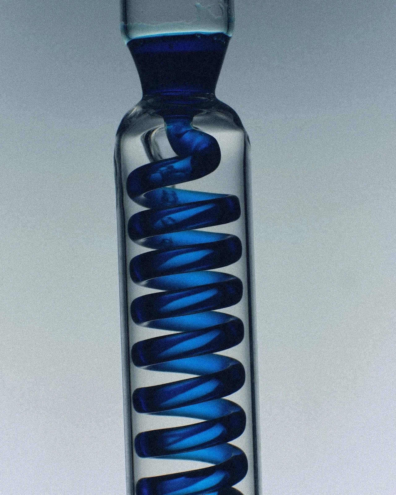 gifted adults therapy - blue liquid in spiral test tube