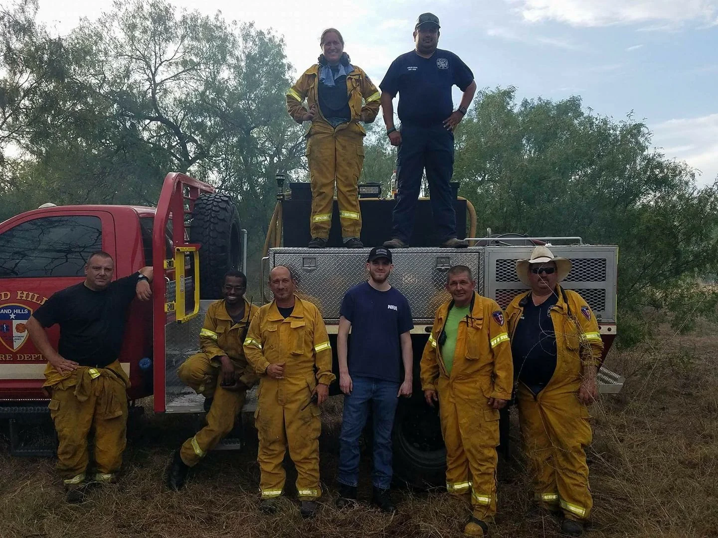 Crew photo taken after a wildland fire just before clearing scene.
From left to right (Top: Kelly Hallmark, Carlos Chapa; Bottom: KB Hallmark IV, Hamza Ball, Scotty Davidson, Brandon ___, Eric Platt, Kenneth Palmer.