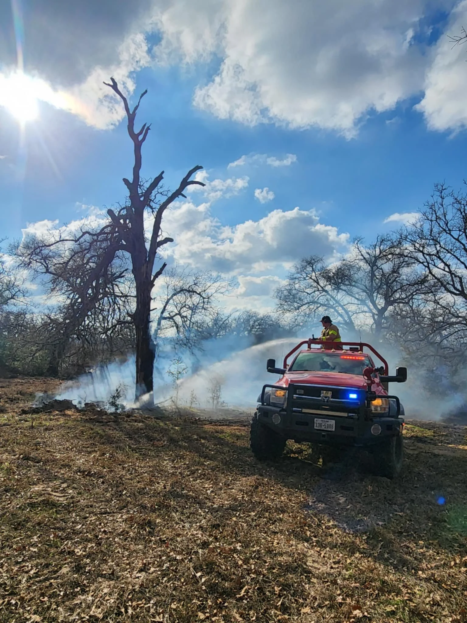 Brush 5725 and crew extinguishing hotspots on a brush fire off of Nockenut.