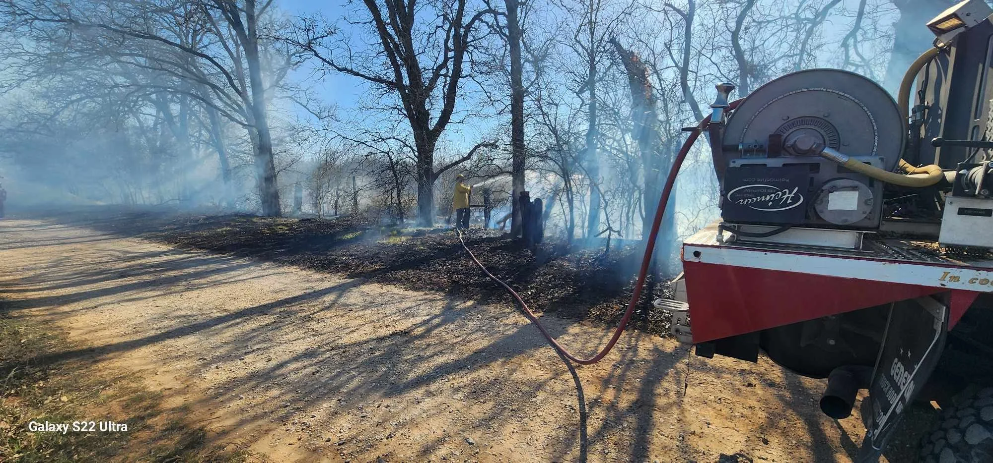 Captain Hallmark IV and Brush 5725 extinguishing hotspots while providing mutual aid to Seguin FD on a brush fire.