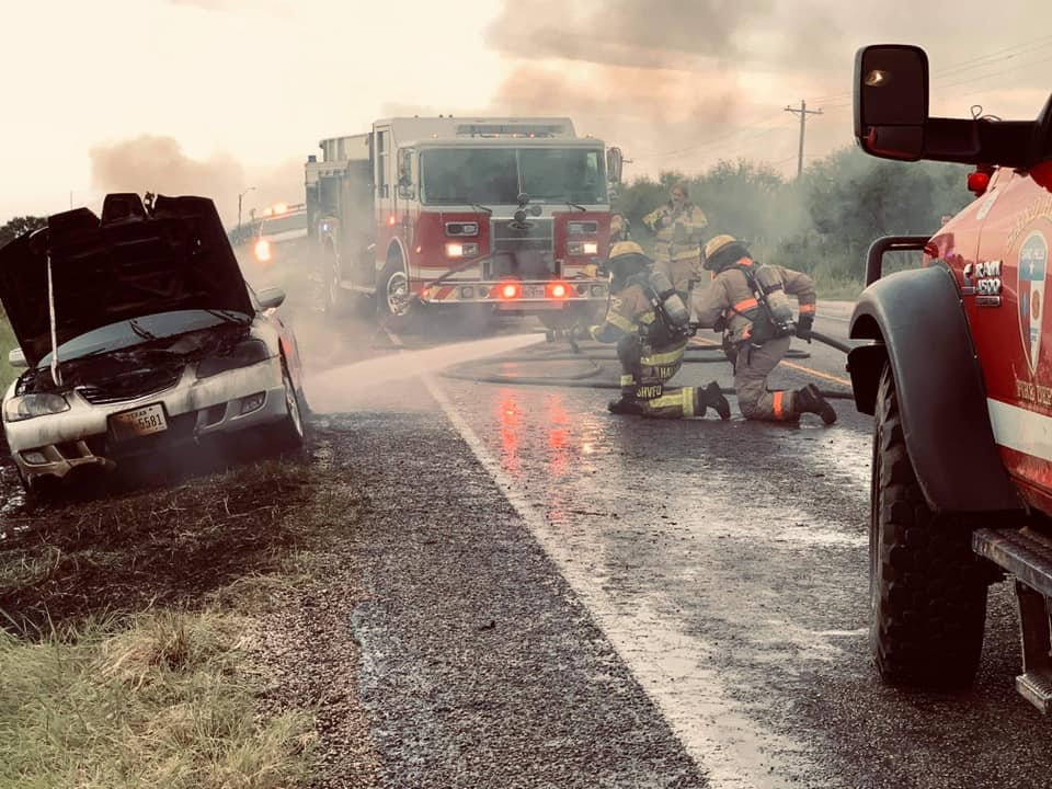 FF/Lic. Paramedic Hallmark V, and FF/EMT-A Beicker Extinguishing a stubborn vehicle fire.