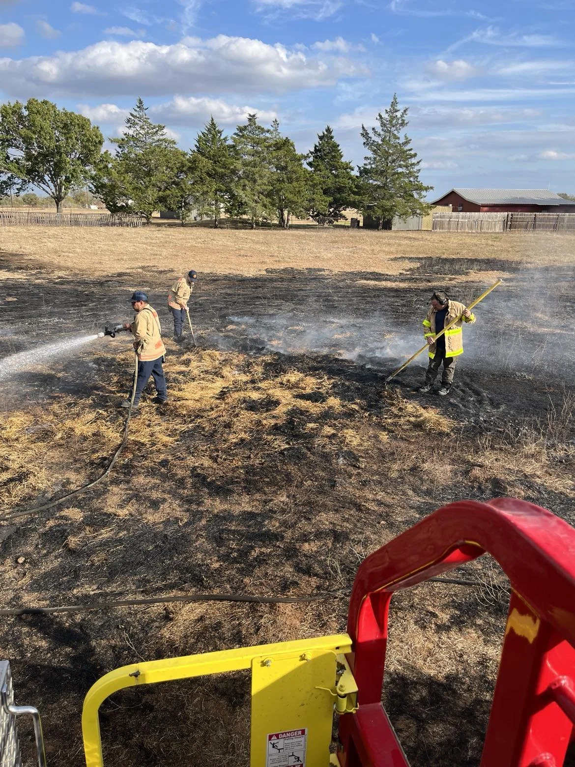 Captain Hallmark IV, and Seguin FD firefighters extinguishing a hay field fire, after SHVFD was requested for mutual aid assistance.