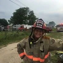 Kelly Hallmark (captain at the time) taking a break after fighting a structure fire.