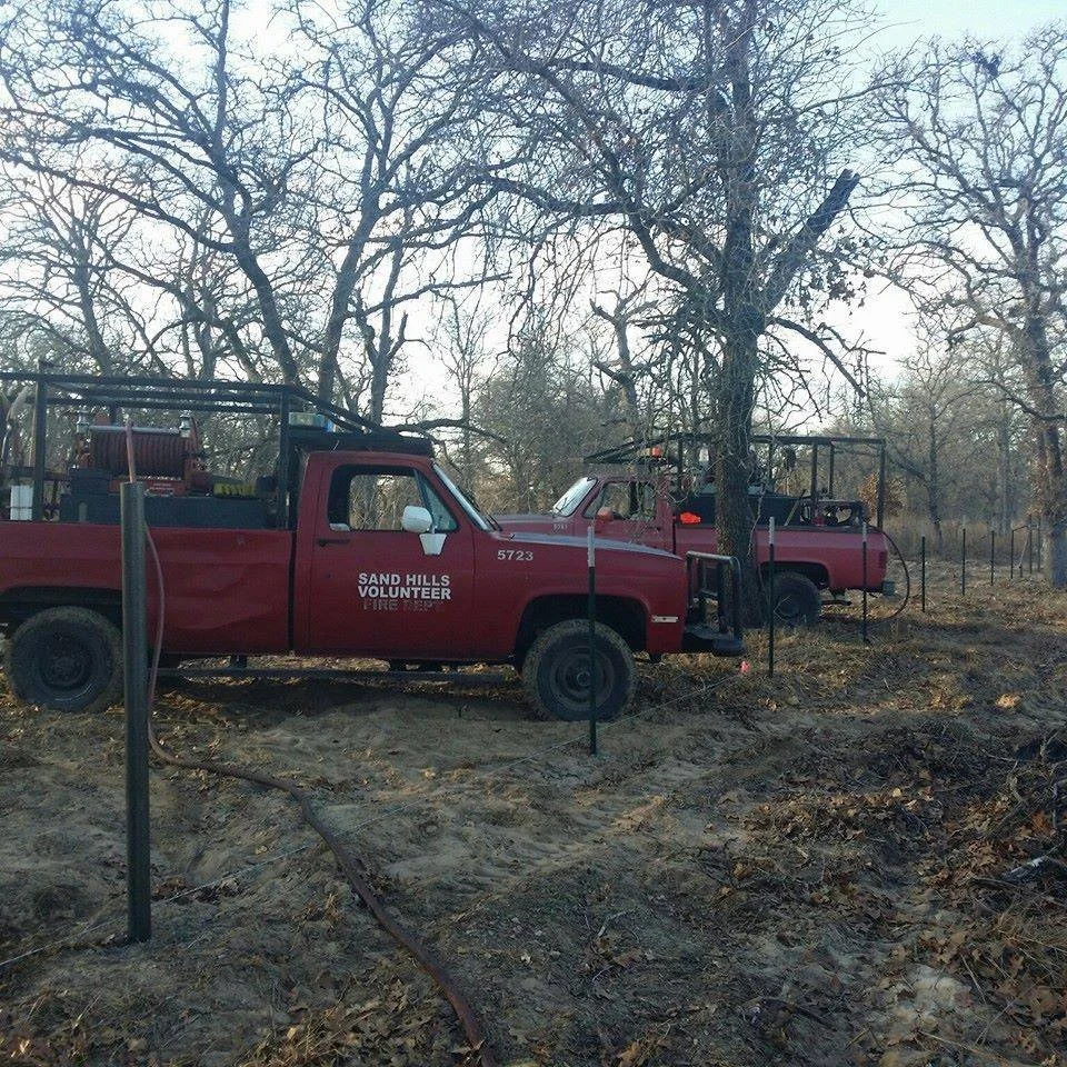 Brush 5723, and 5721 extinguishing hotspots on a brush fire.