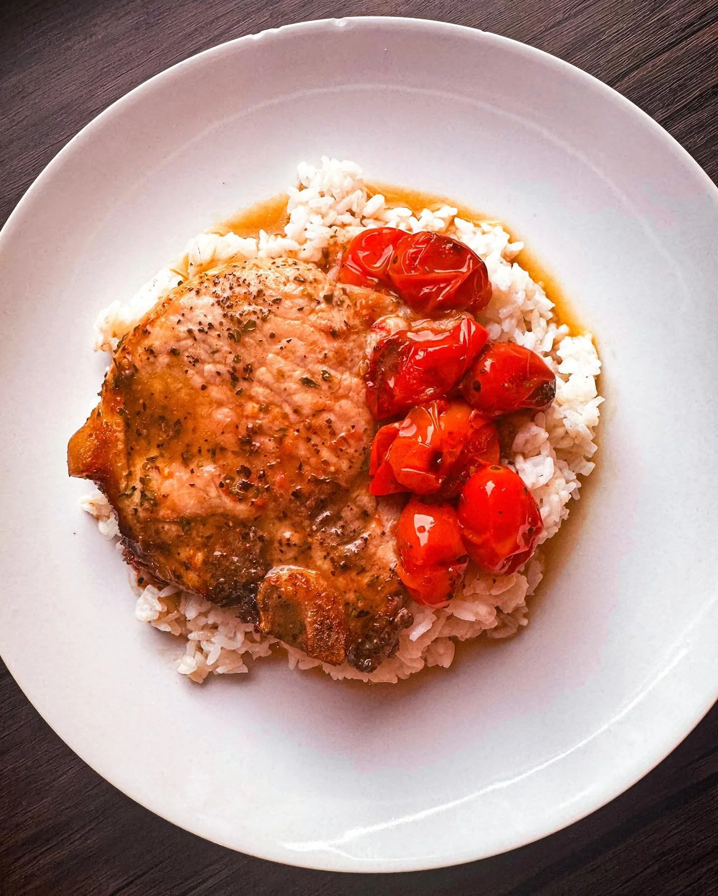 Pork Chops in a Light Garlic Tomato Butter Sauce

Juicy pork chops, buttery skillet sauce, and tomatoes that literally burst with flavor. Pile it all on top of warm rice and let every drop of that sauce soak in. It&rsquo;s cozy, it&rsquo;s flavorful,