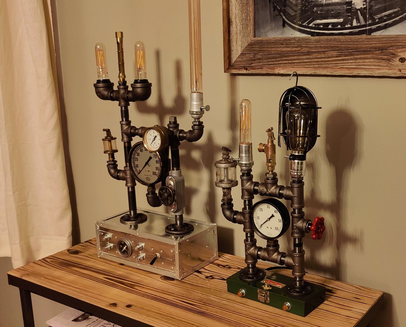 Steampunk-inspired lamp and clock made of pipes, gauges, and vintage light bulbs on a wooden table.