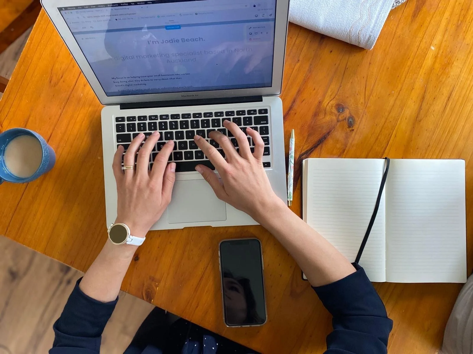 Jodie Beach typing on a laptop.