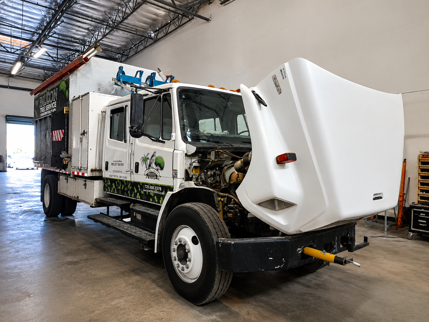 Medium-duty commercial truck receiving diagnostics and repair service at JC Diesel fleet repair shop in Las Vegas.