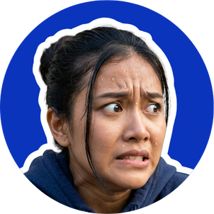 Close-up of a woman with a worried or anxious expression, dark hair pulled back, against a blue background.