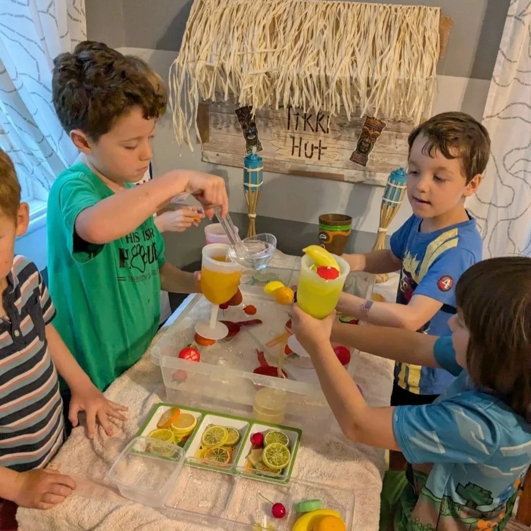 Children making tropical drinks for Beach Week at The Great Wide Open Center