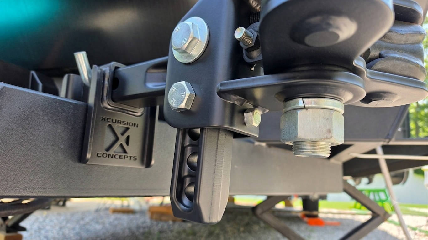 The Hitch Holster mounted on a travel trailer A-frame securely holding a heavy weight distribution hitch shank