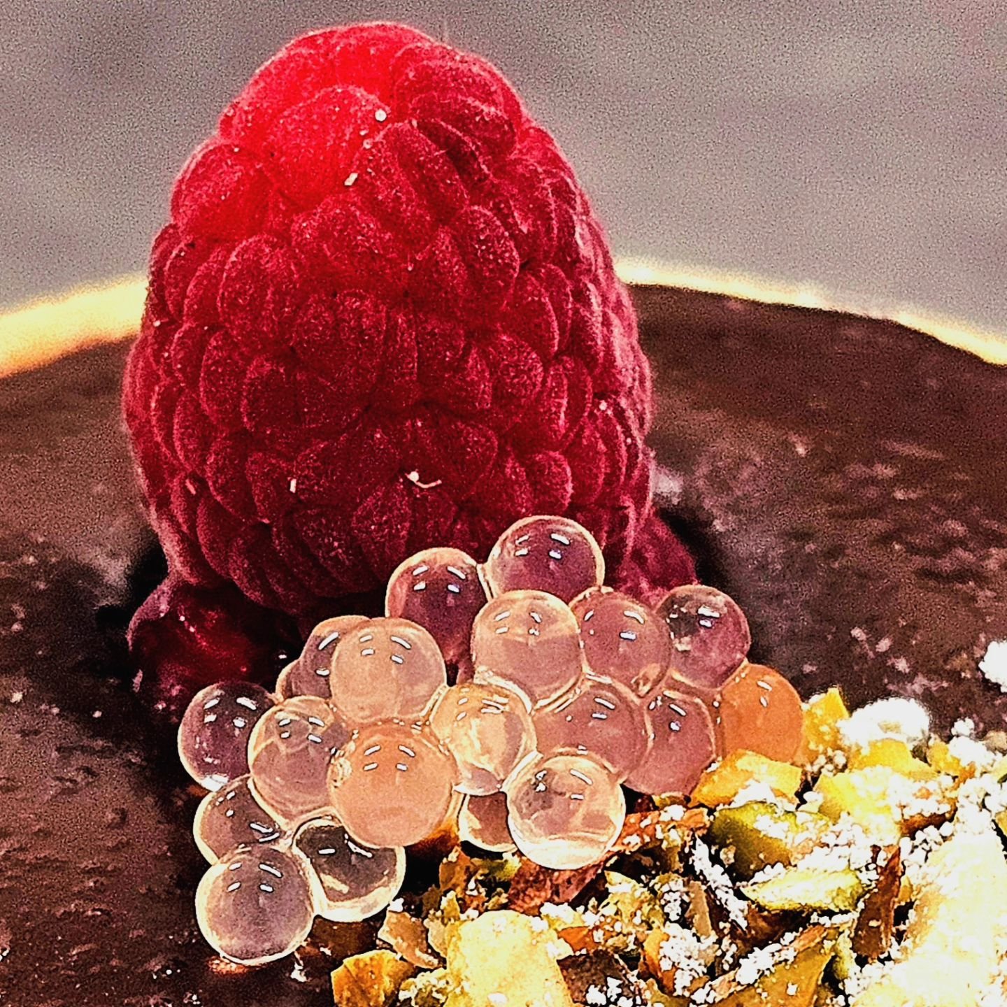 Belgian Dark Chocolate ganache tart, topped with raspberry,  pistachio and Pink Grapefruit Garnishing Pearls.
The Garnishing Pearls are available online at www.nicholsonfinefoods.com.au 
Free shipping anywhere in Australia for orders over eighty doll