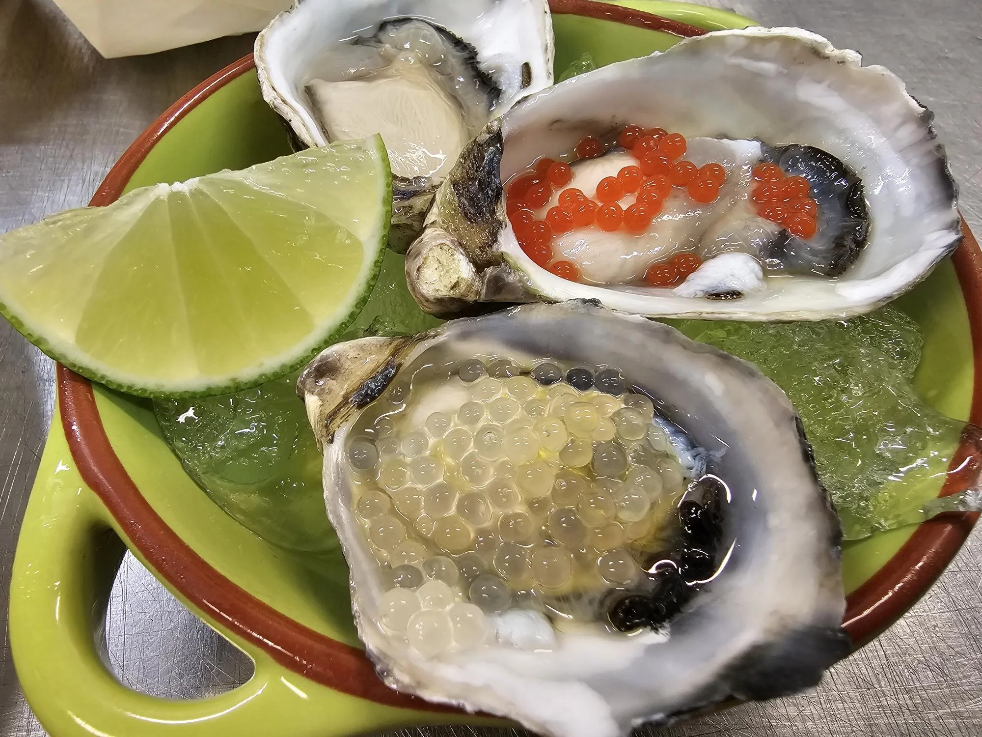 Oysters with Gin, EVOO, and Garnishing Pearl dressing.jpg