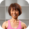 Middle-aged woman with short brown hair and wearing pink fitness shirt.