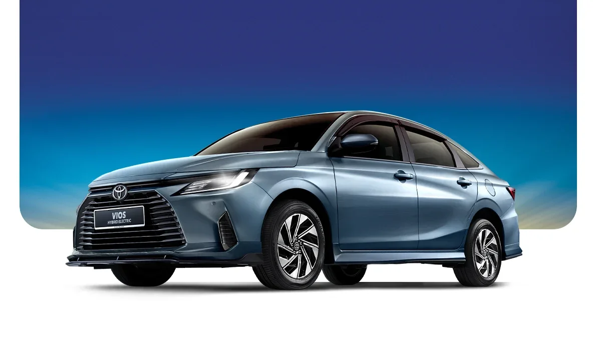 A blue Toyota hybrid electric sedan parked against a gradient background.