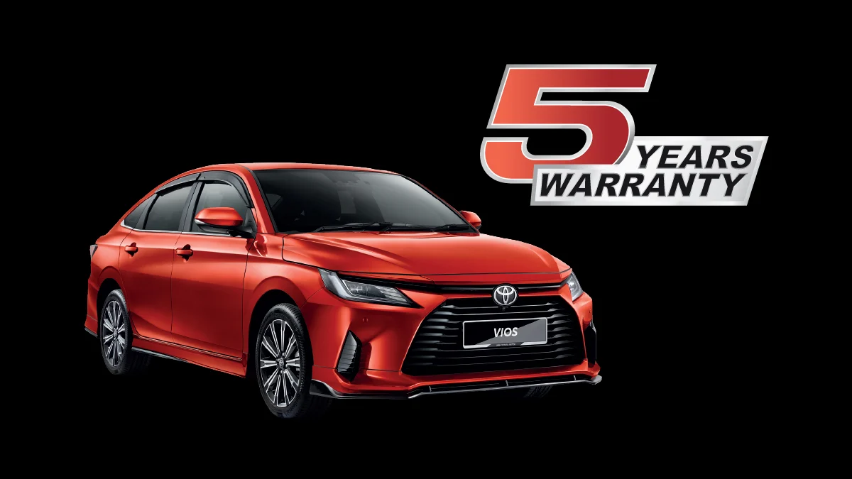 Red Toyota Vios sedan with a black background, featuring a banner that says "5 Years Warranty".