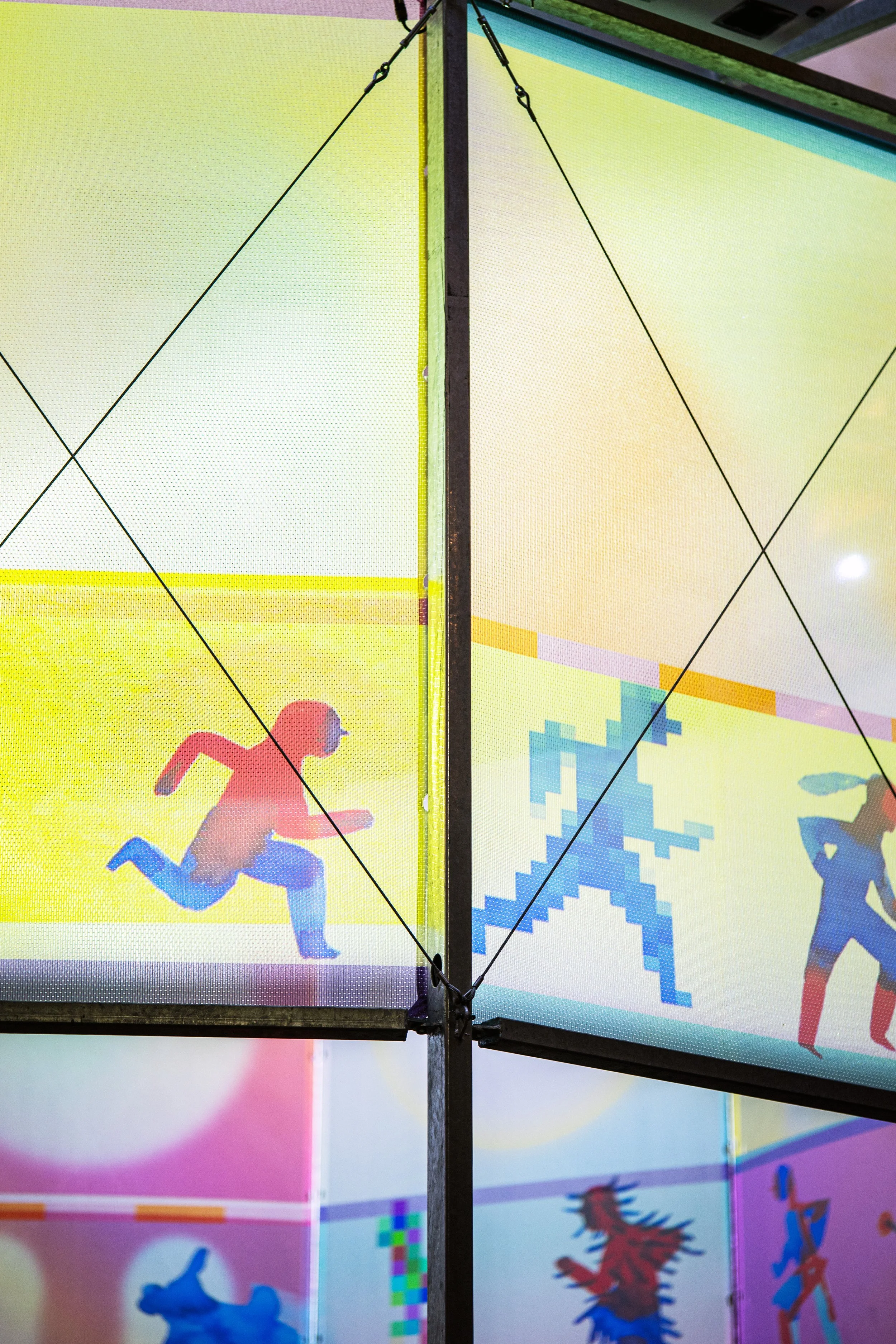 Detail of hybrid artwork combining printed illustration and large-scale video projection.