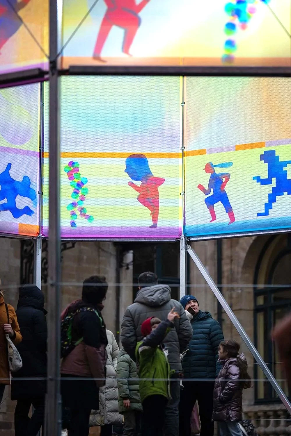 Detail of hybrid artwork combining printed illustration and large-scale video projection.