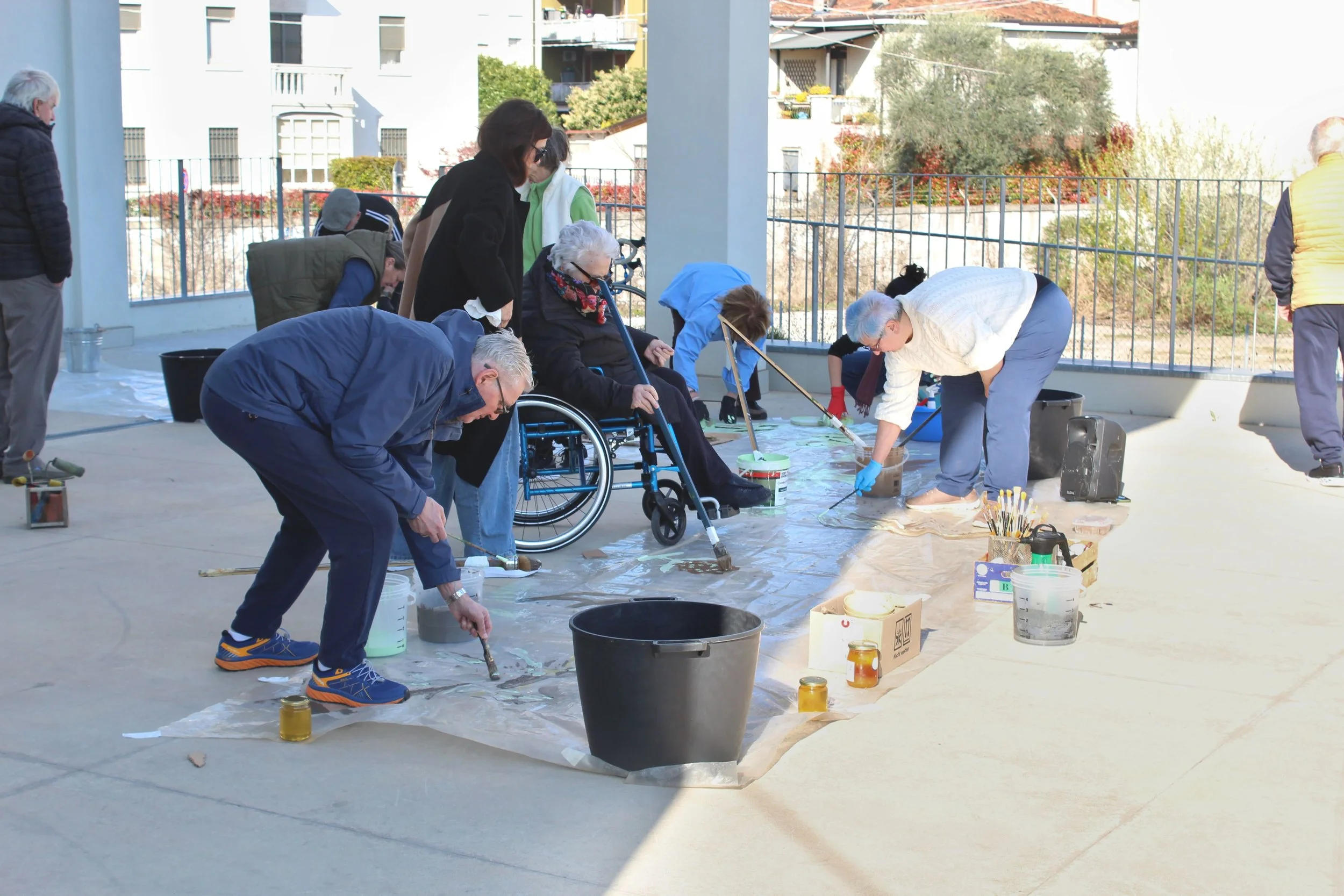 Parkinson Project by Davide Sozio, long-term collaborative painting with the Parkinson Vicenza Association, 2022–2026 - participants at work.