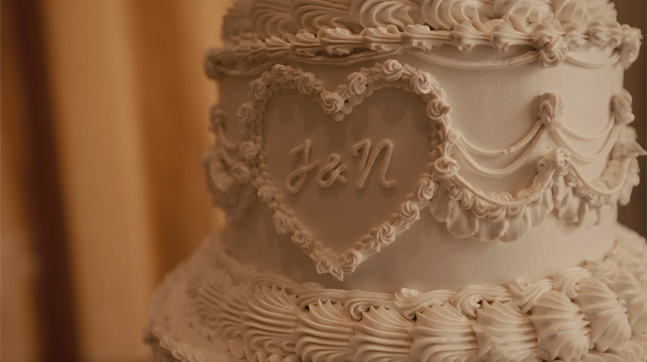 wedding cake with J&N initials in