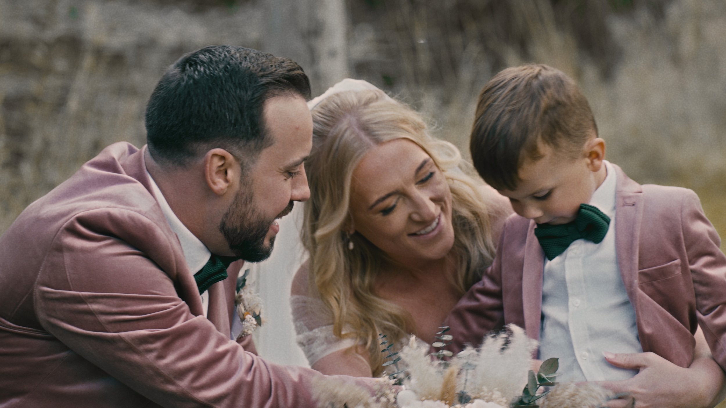 Bride and groom playing with their nephew.