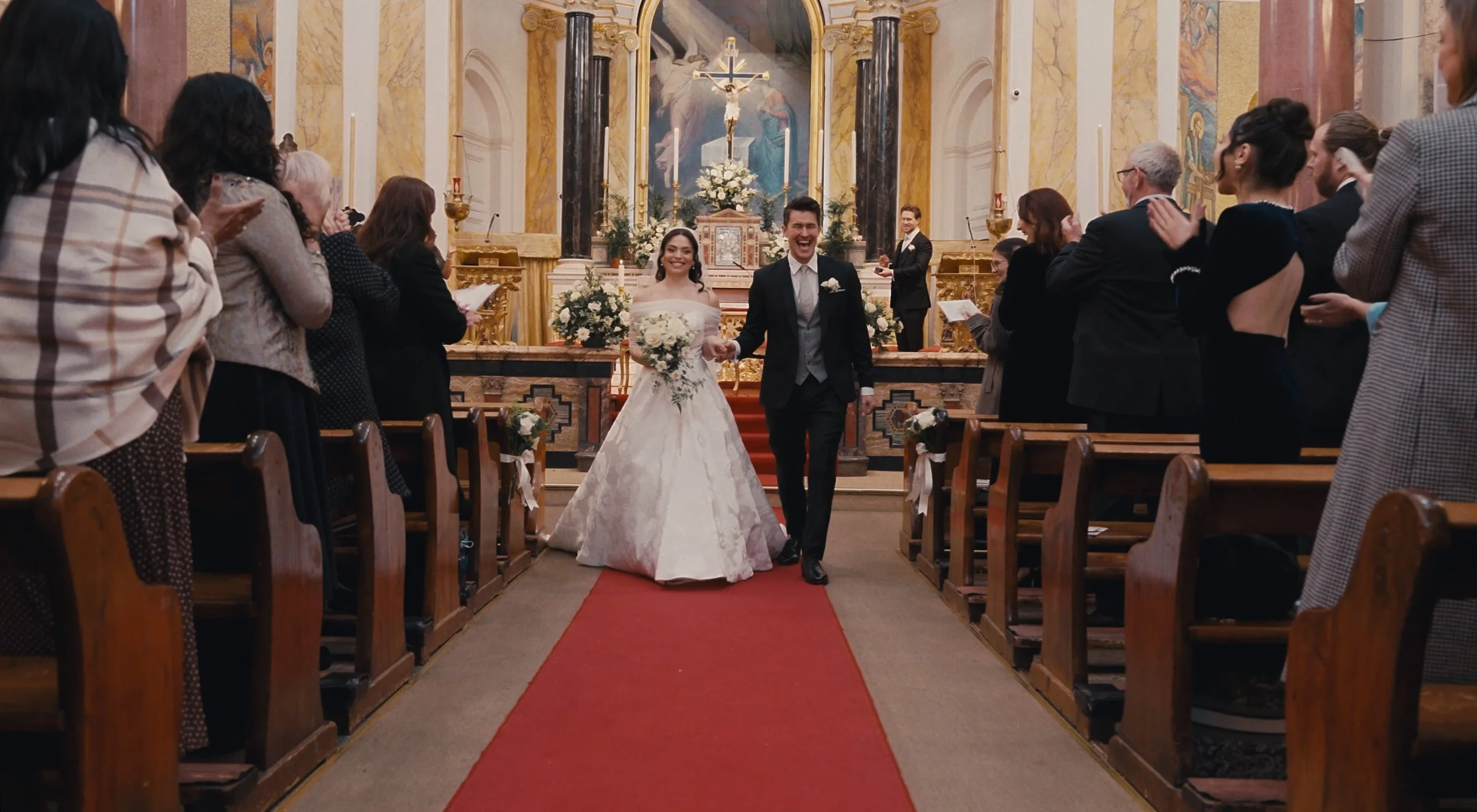 Bride and groom walking down the aisle