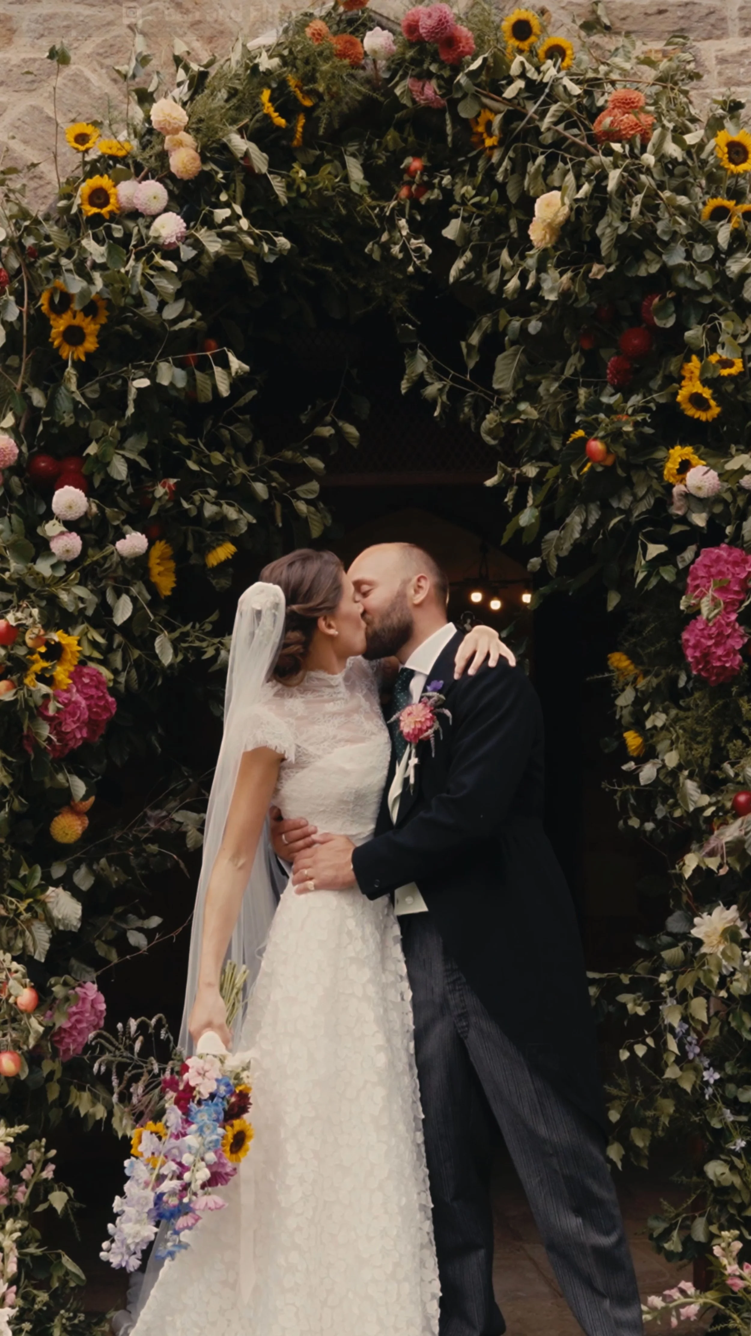 Couple kissing outside church