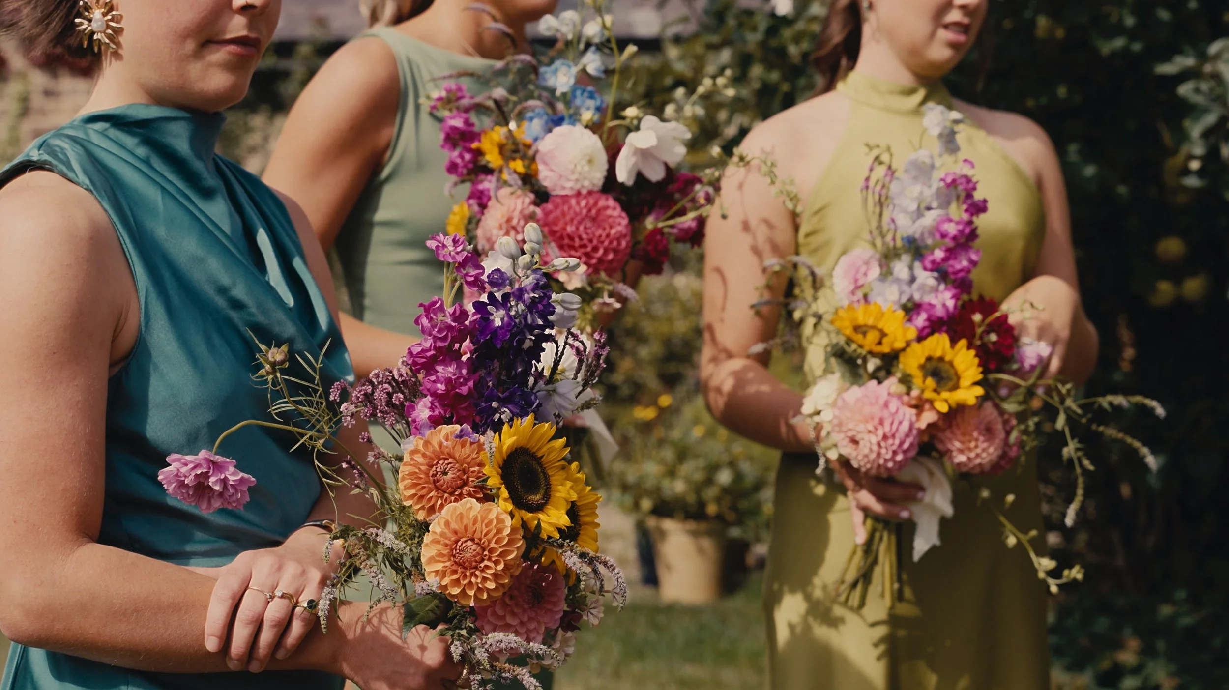 Bridesmaids holding flowers
