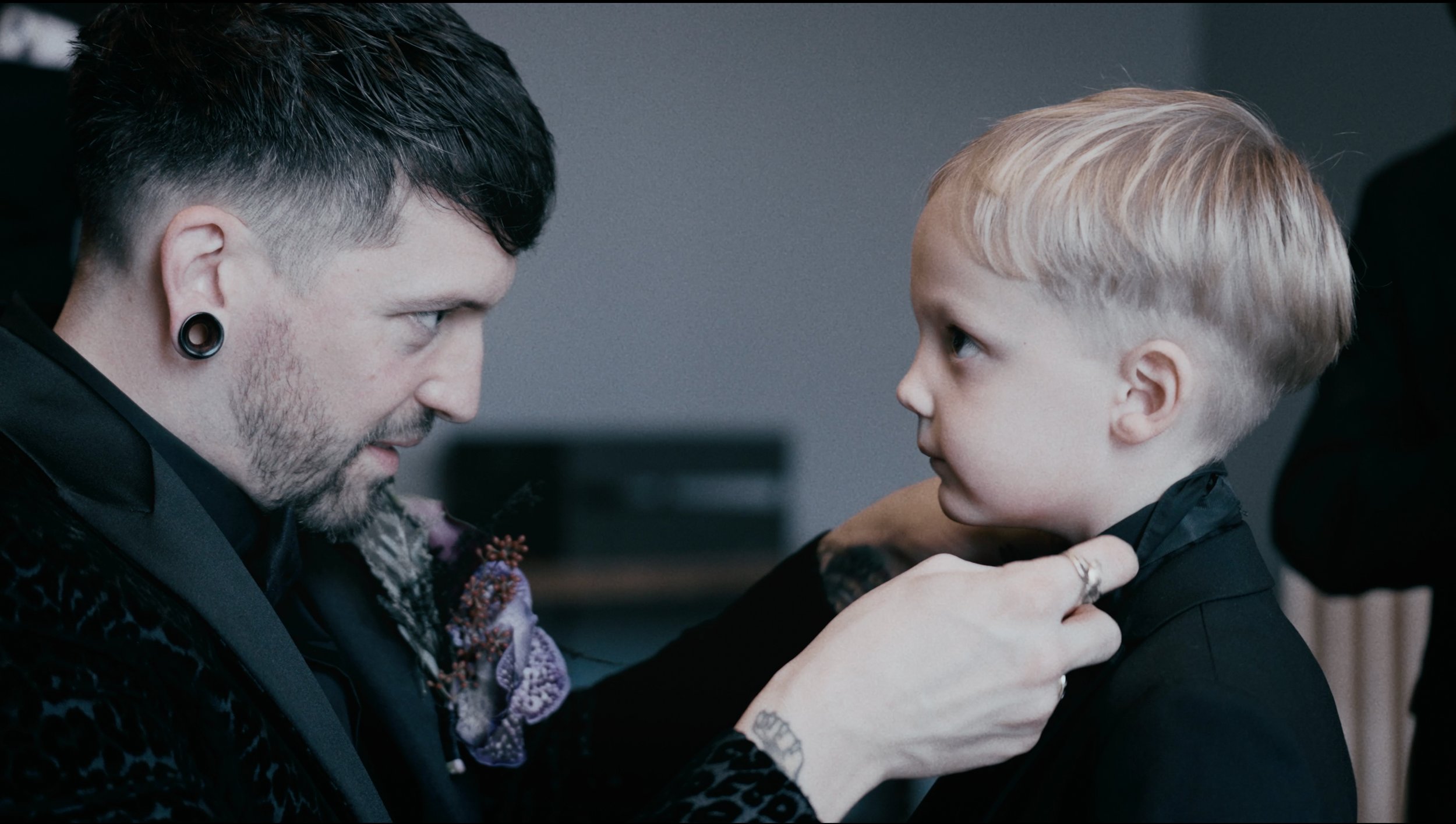 groom helping his son get ready