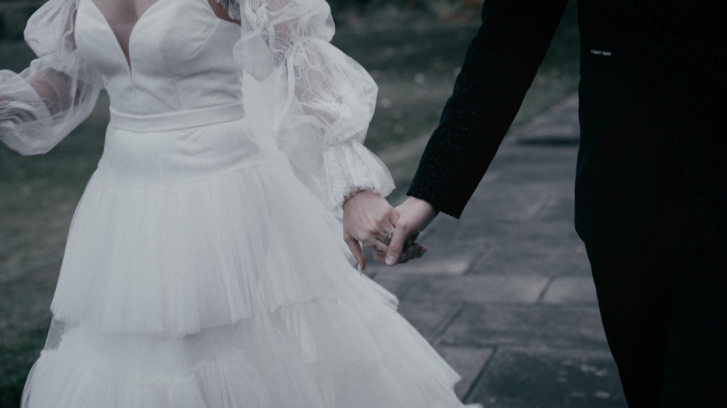 Bride and groom holding hands