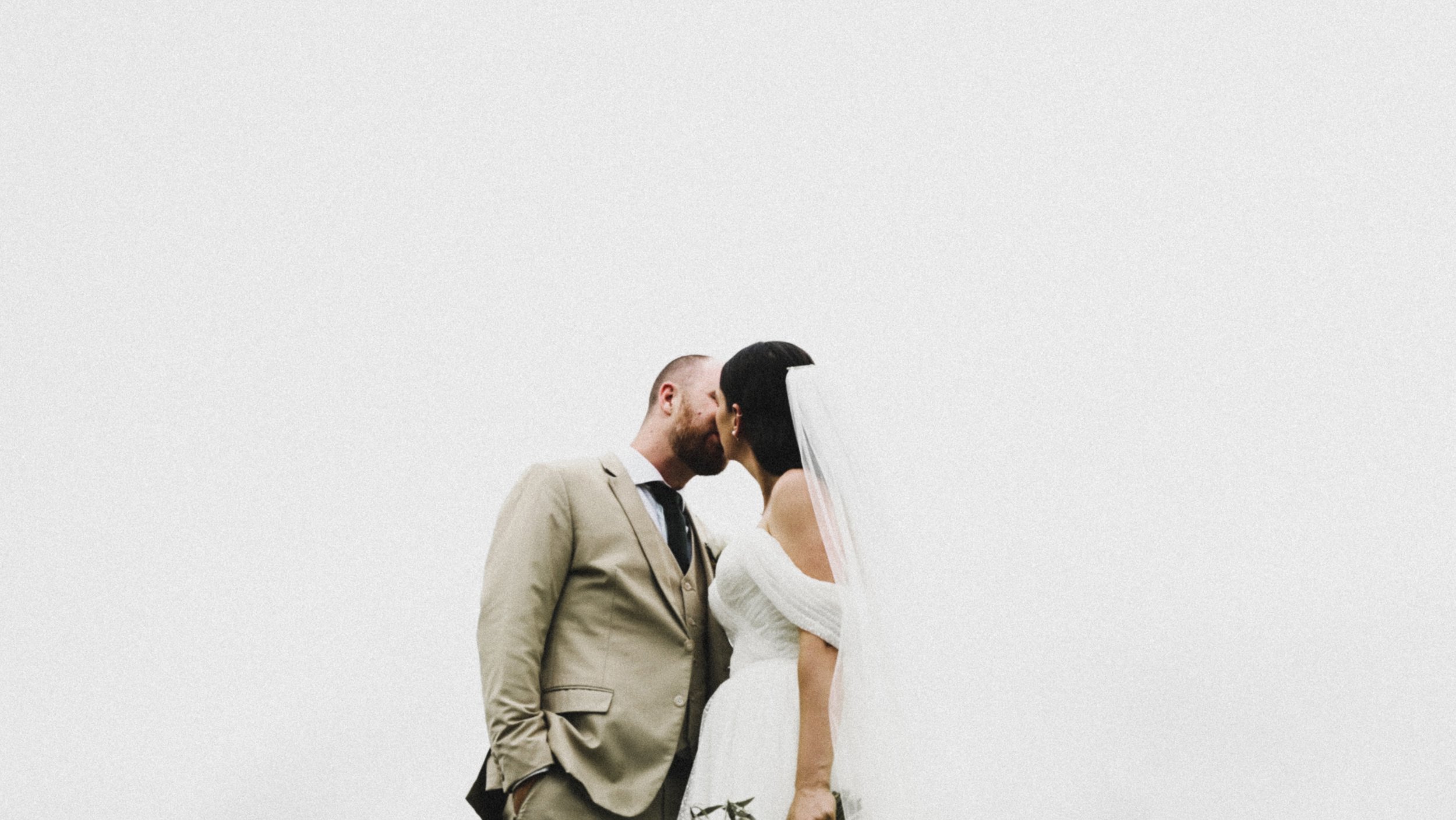 Bride and groom kissing
