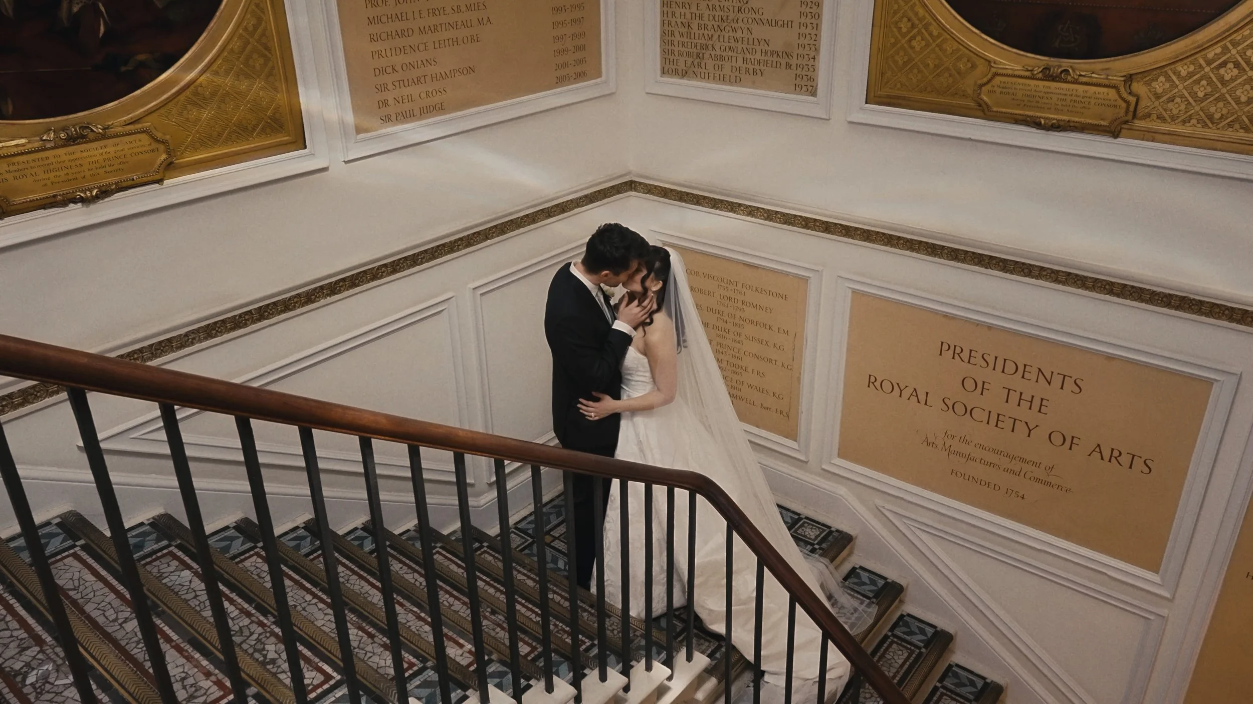 Bride and groom kissing on stairs in RSA