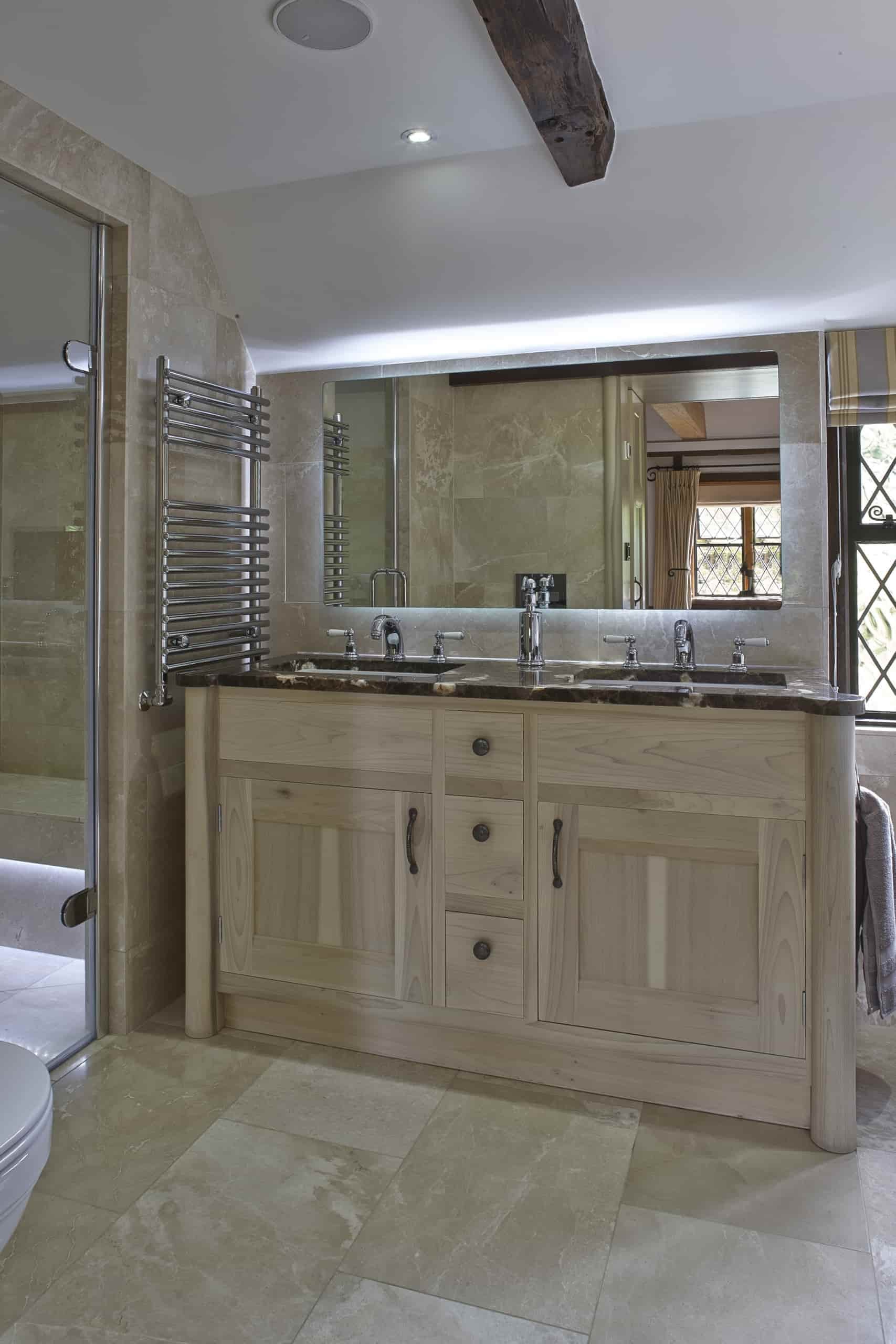 Handmade tulip wood bathroom cabinet in luxury Surrey master en-suite.