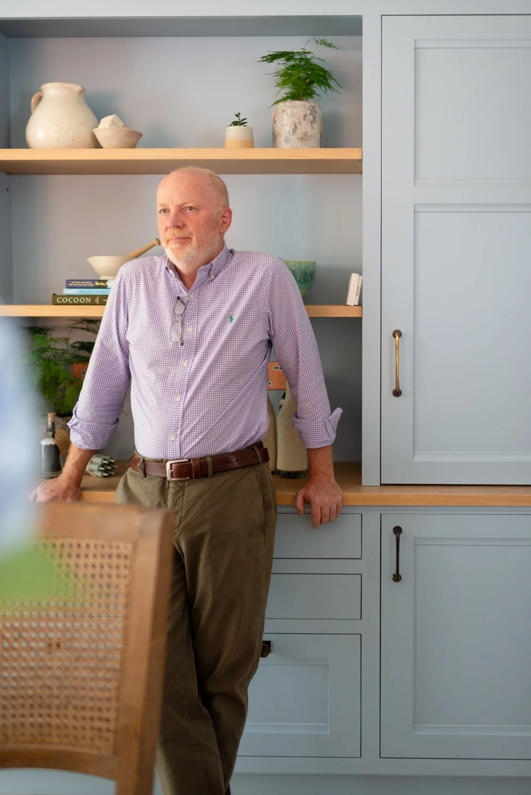 Giles Slater, Founder and Creative Director of Figura Ltd, in handmade Surrey kitchen setting.