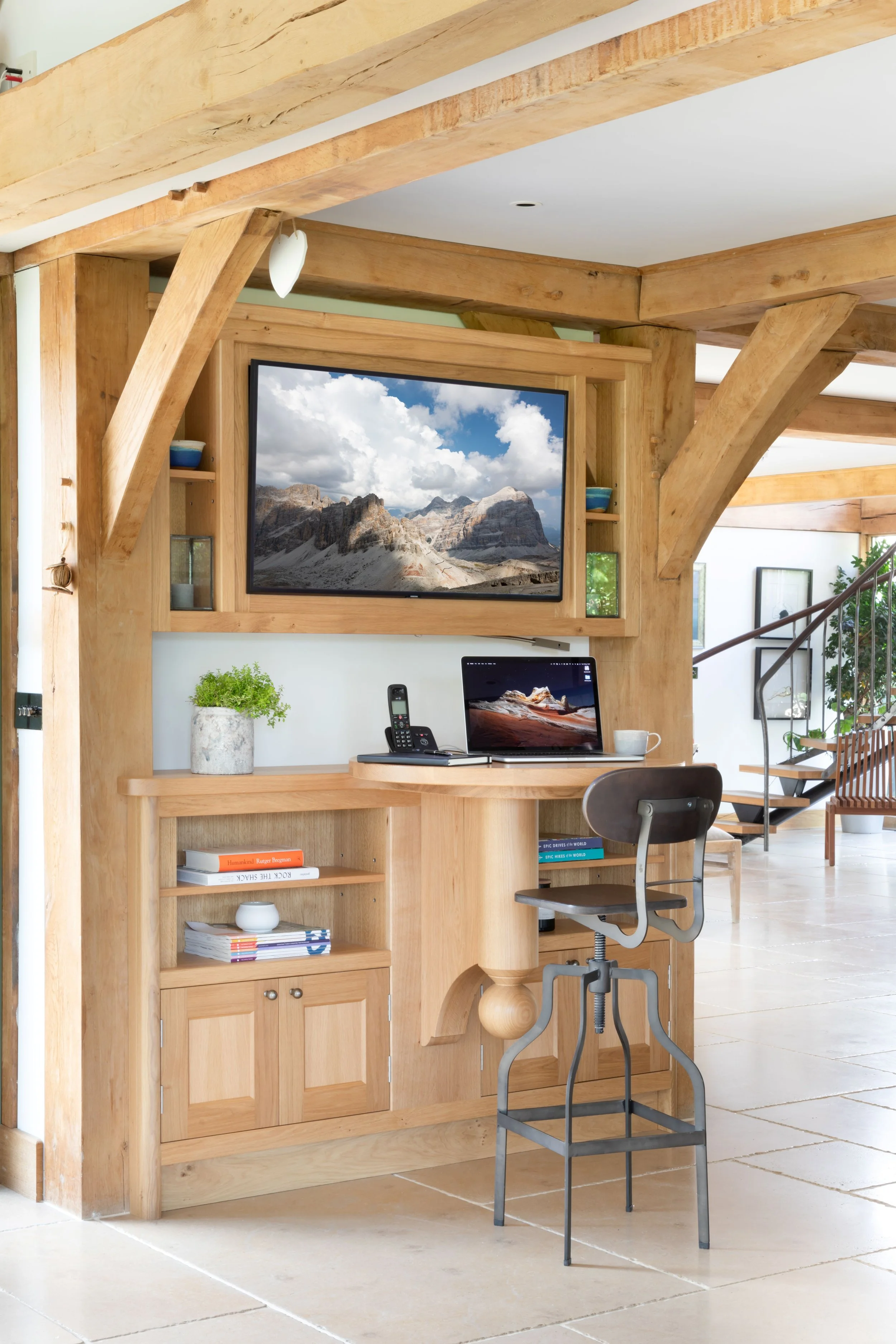 Home office nook built into handmade green oak beams in Guildford home.