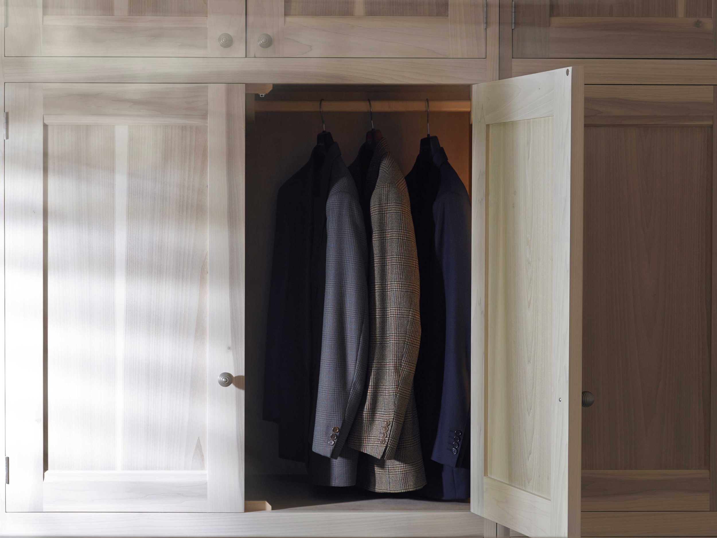 tulip wood bespoke wardrobe with men's suit jackets