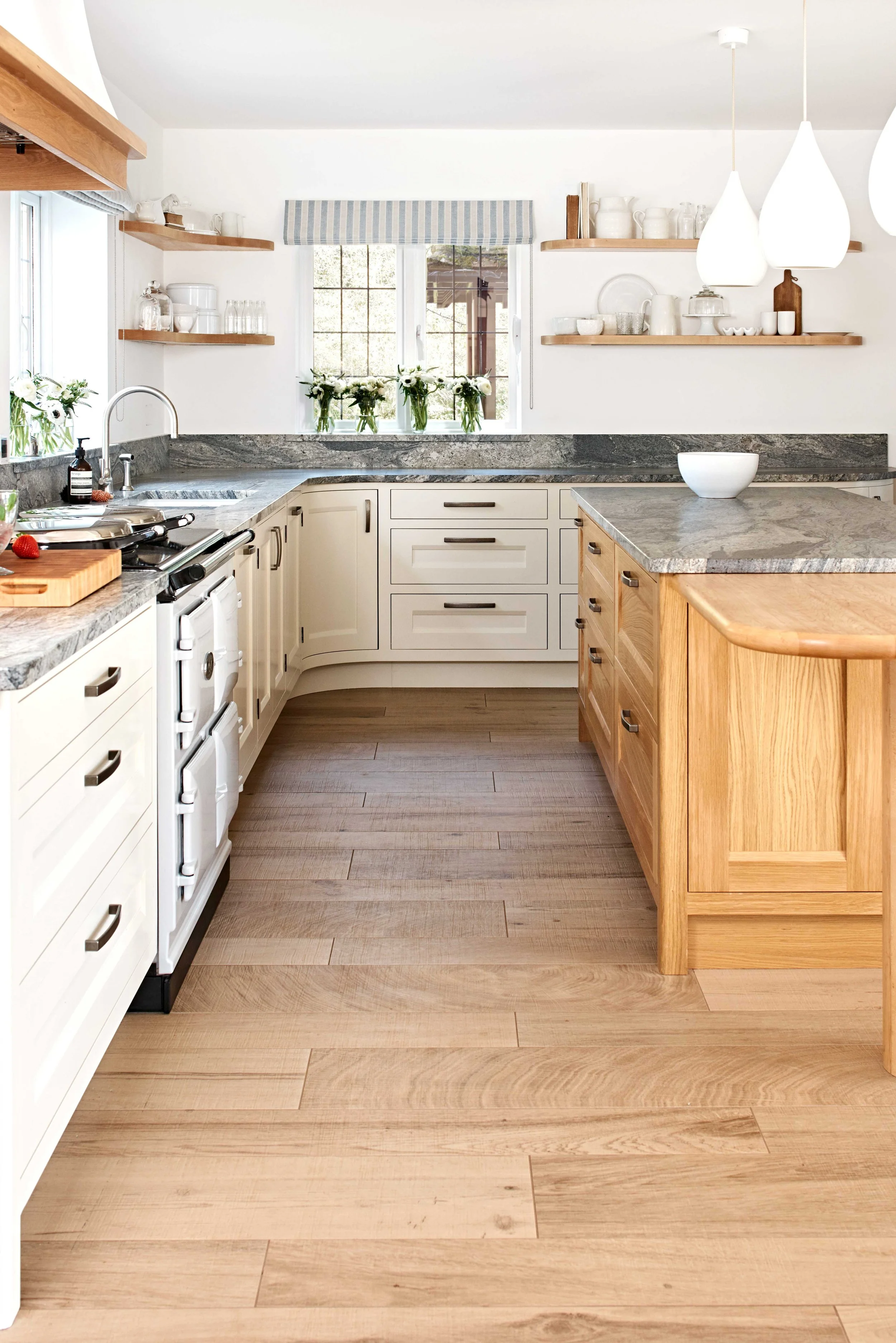 country house bespoke kitchen with island and aga