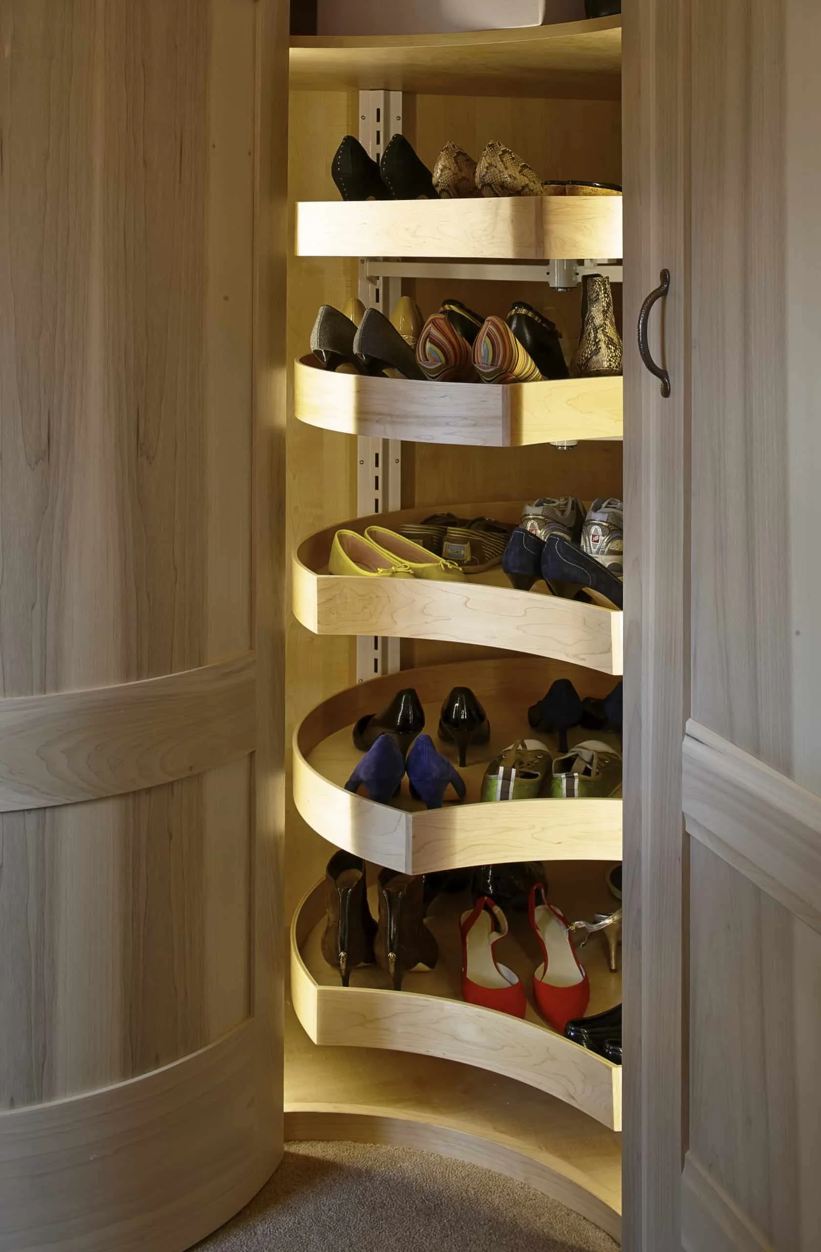 Handmade bespoke oak shoe carousel storage in Surrey dressing room.
