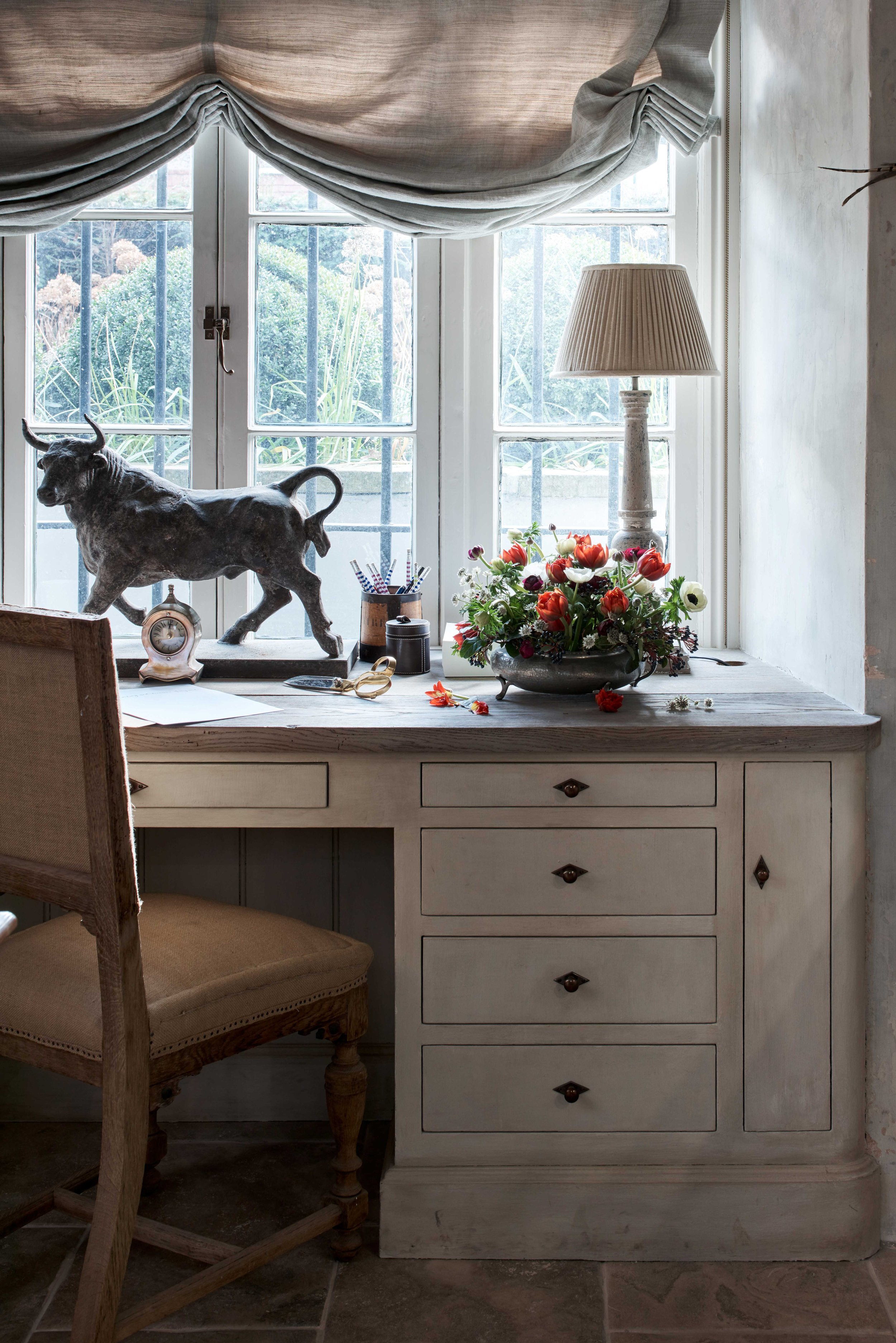 bespoke handmade desk with flowers and scultpure